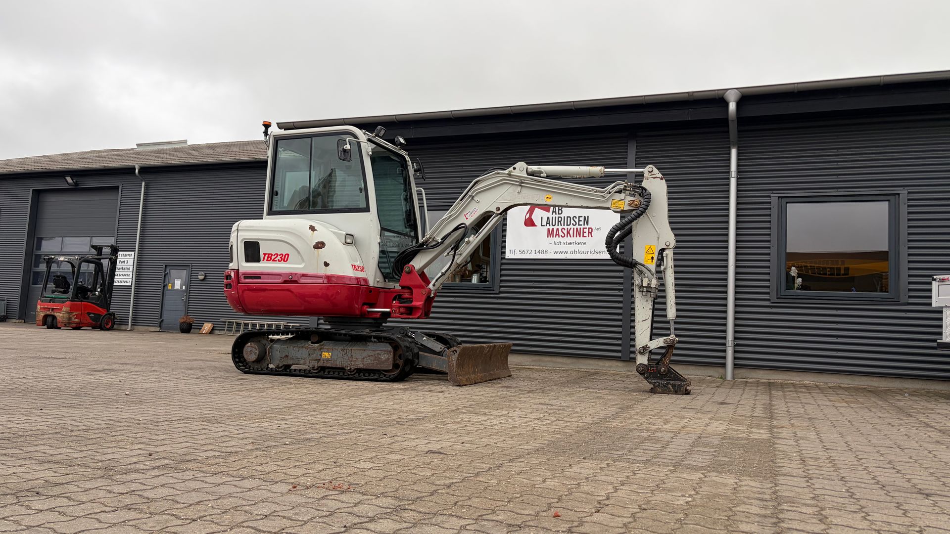 Takeuchi TB230 S40 skifte